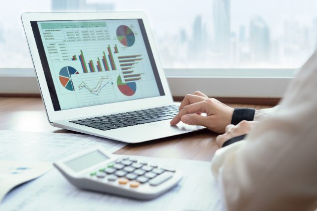 Business Owner opening a financial report about his business